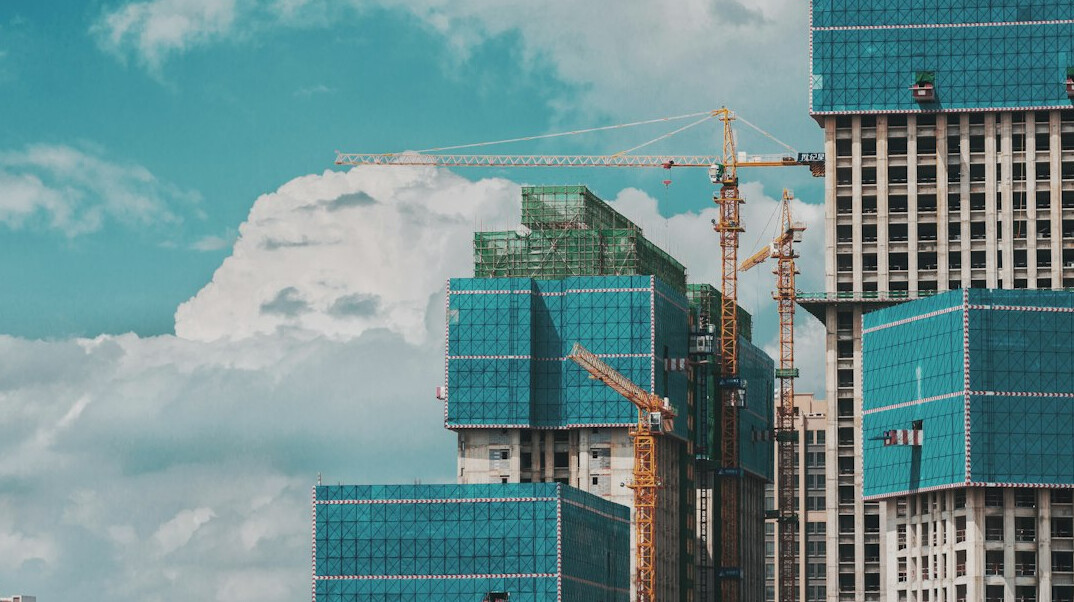 Residential building under construction with a crane