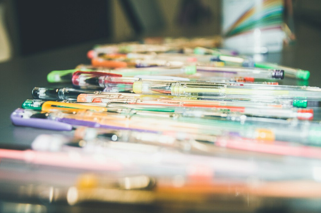 Stack of official documents with a pen on a table